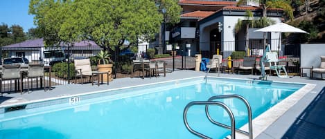 Outdoor pool, open 9:00 AM to 10:00 PM, pool loungers