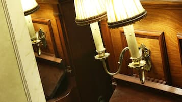 A piano with a polished wooden finish and a reflective surface.