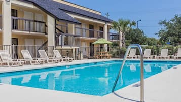 Seasonal outdoor pool, pool loungers