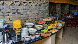 A buffet with various food items and a coffee station. - Great Zimbabwe Hotel (Masvingo)
