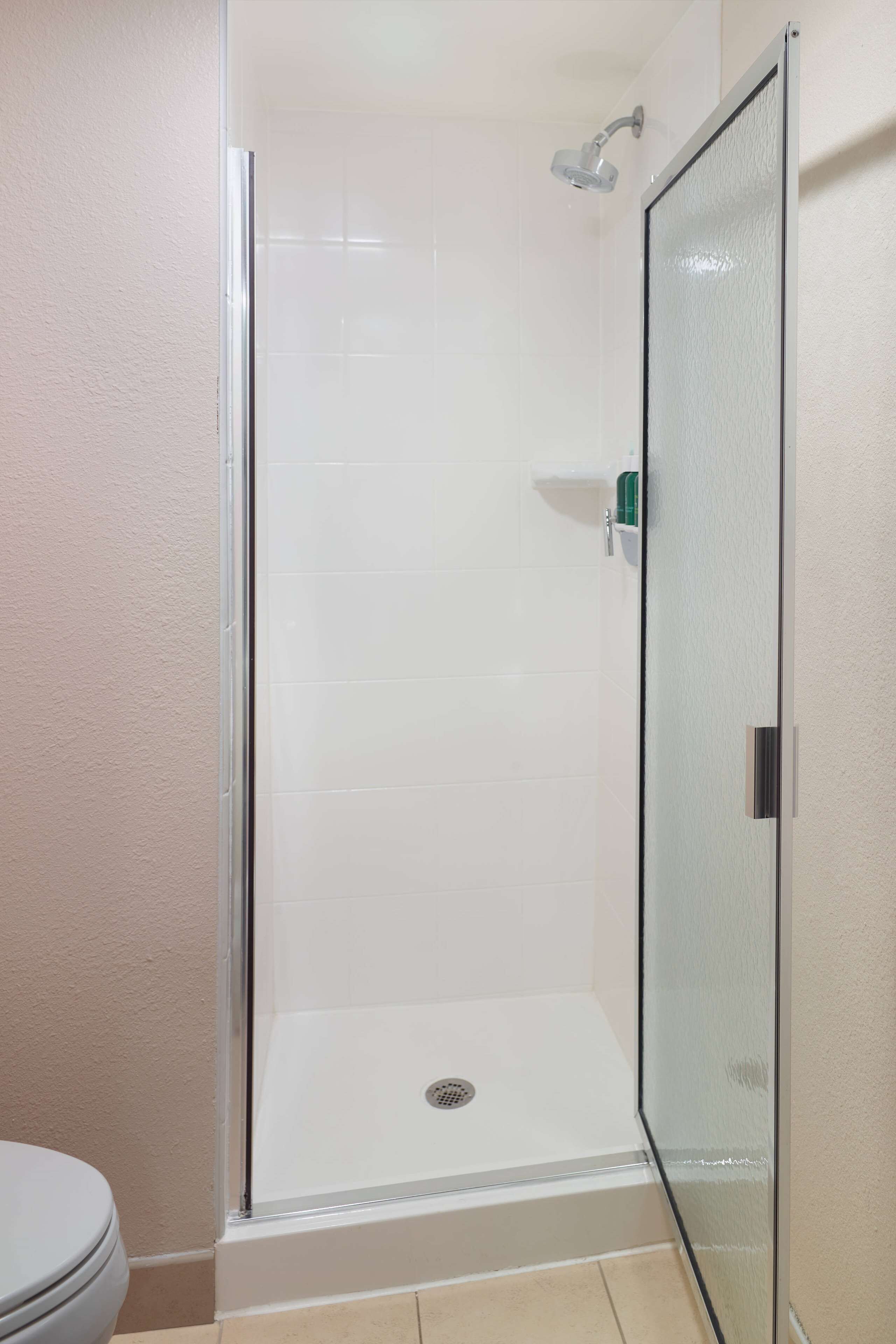 suite, multiple beds (two bedrooms 2 queens) | bathroom | combined shower/bathtub, free toiletries, hair dryer, towels