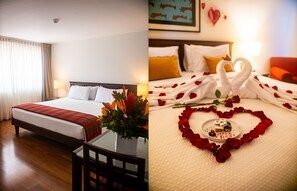 A hotel room with a bed, bedside table, and a view of the outdoors. - San Agustin Exclusive Hotel (Lima)