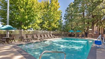 Seasonal outdoor pool, open 8:00 AM to 10:00 PM, pool umbrellas