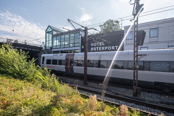 A modern train station with a glass building labeled "HOTEL OSTERPORT". - Go Hotel Østerport (Copenhagen)