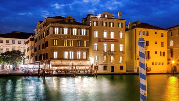 Hotel Continental with a waterfront view, featuring multiple floors and a prominent sign. - CHC Continental, BW Premier Collection (Venice)