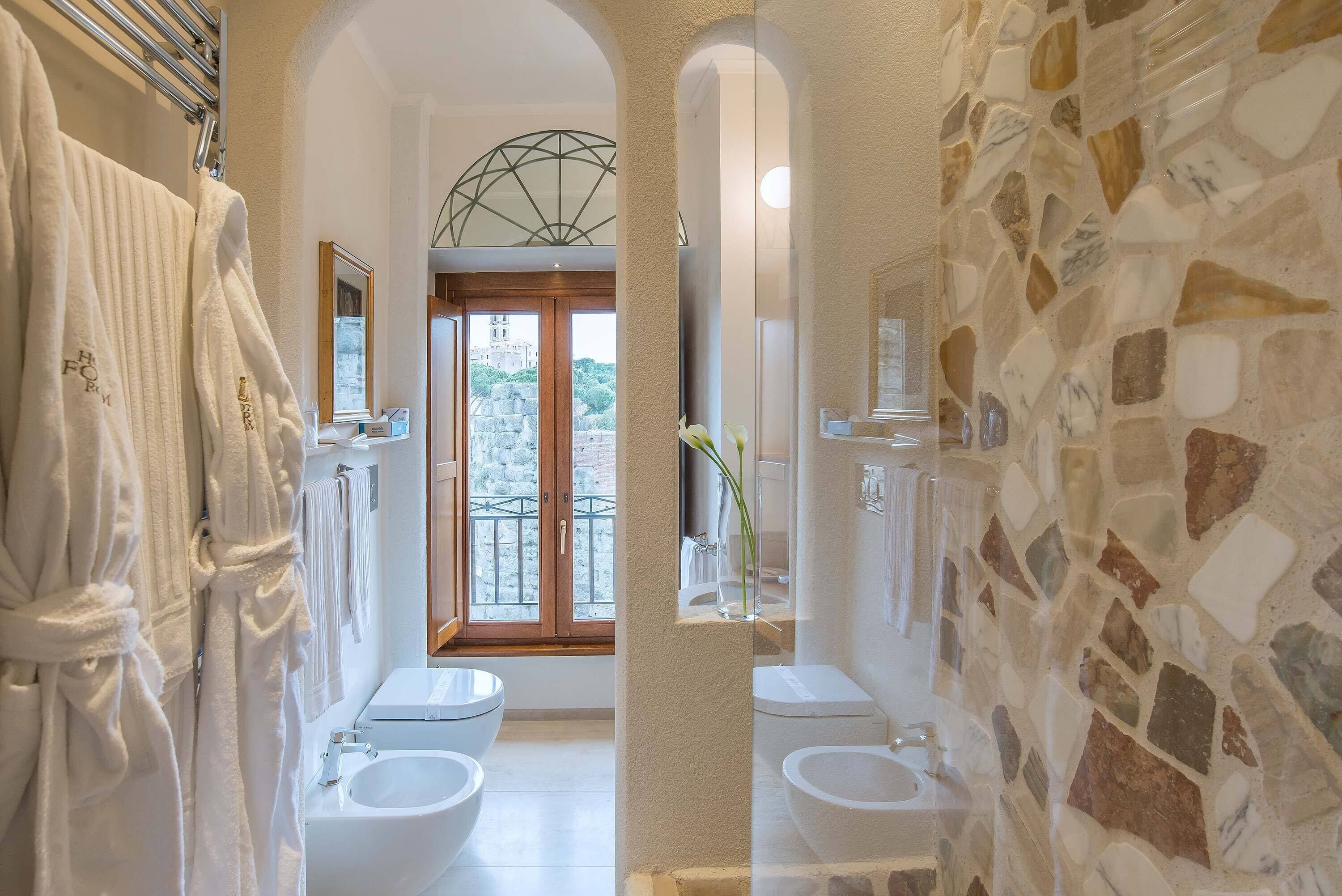 deluxe double room, city view | bathroom | combined shower/bathtub, free toiletries, hair dryer, slippers