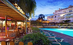 Seasonal outdoor pool, open 9:00 AM to 6:00 PM, pool umbrellas
