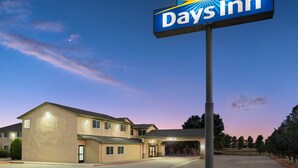 A Days Inn hotel with a clear sky and a sunset.