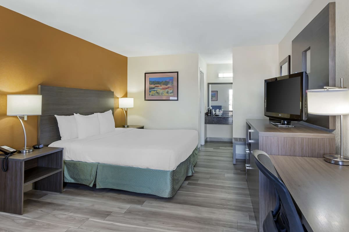 desk, laptop workspace, blackout curtains, iron/ironing board