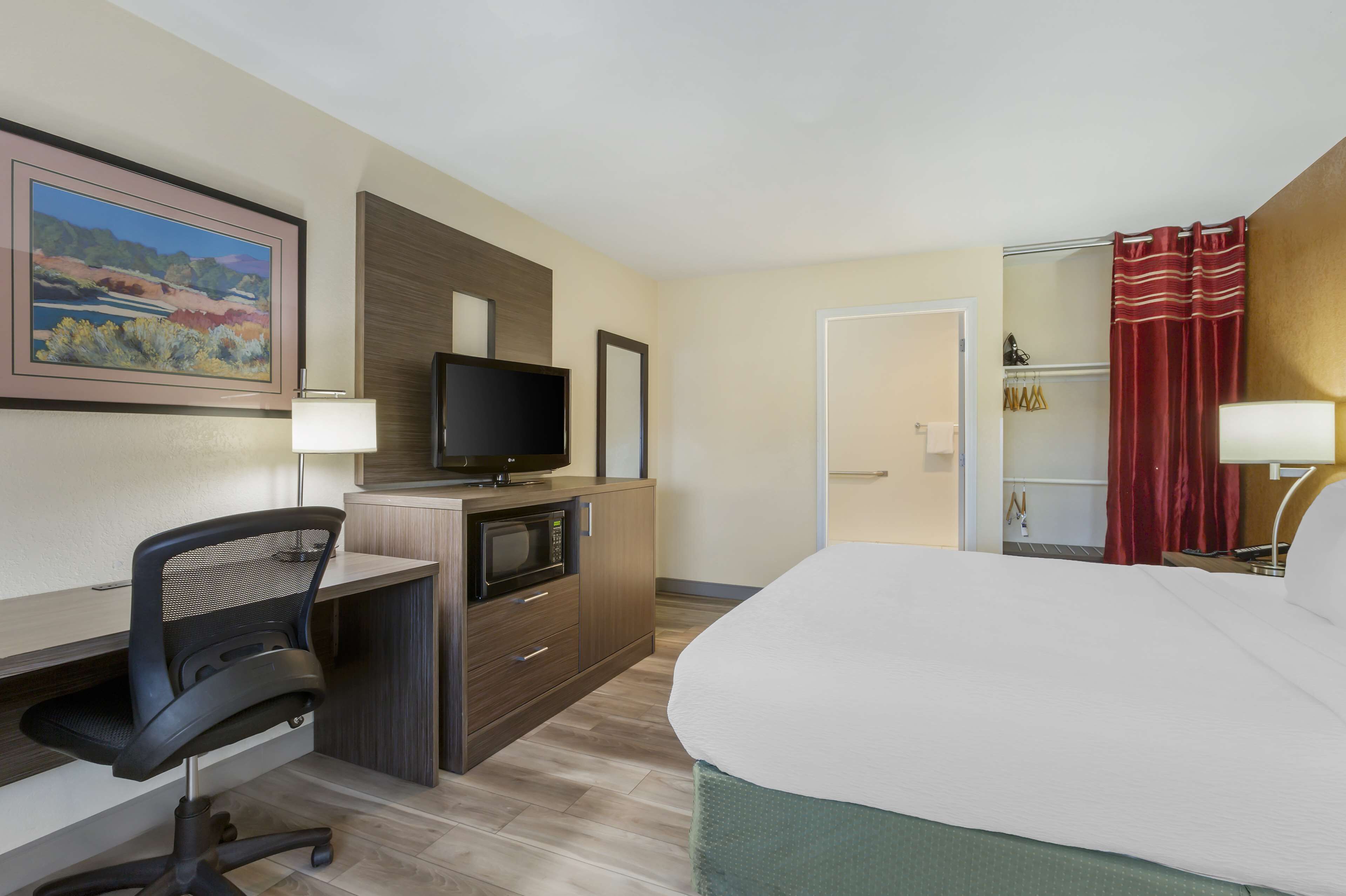 desk, laptop workspace, blackout curtains, iron/ironing board