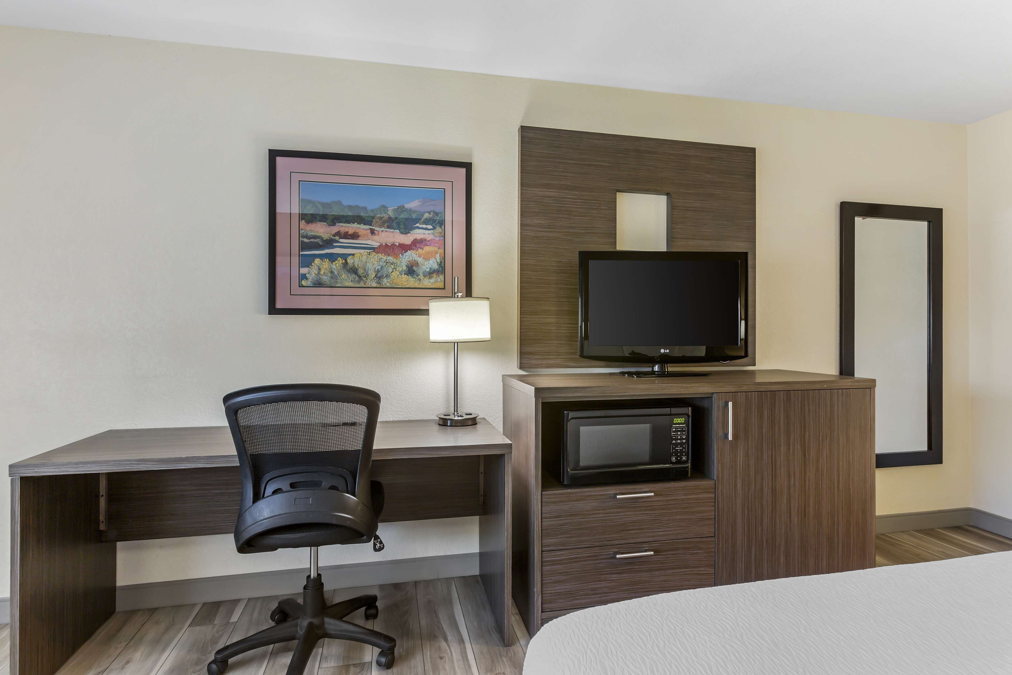 desk, laptop workspace, blackout curtains, iron/ironing board