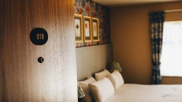 Individually decorated, desk, blackout drapes, iron/ironing board