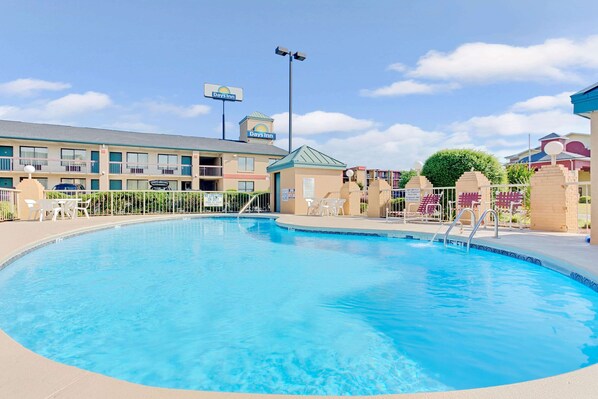 Seasonal outdoor pool, open 9 AM to 8 PM, pool loungers