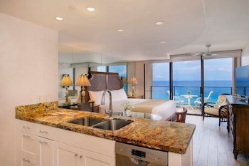 Premium Studio, Kitchen, Oceanfront | In-room safe, individually decorated, desk, laptop workspace at Aston Mahana at Kaanapali