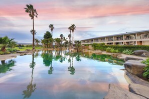 2 outdoor pools, open 7 AM to 10 PM, pool umbrellas, pool loungers