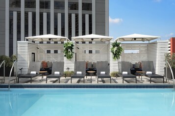 Seasonal outdoor pool, free pool cabanas, pool umbrellas