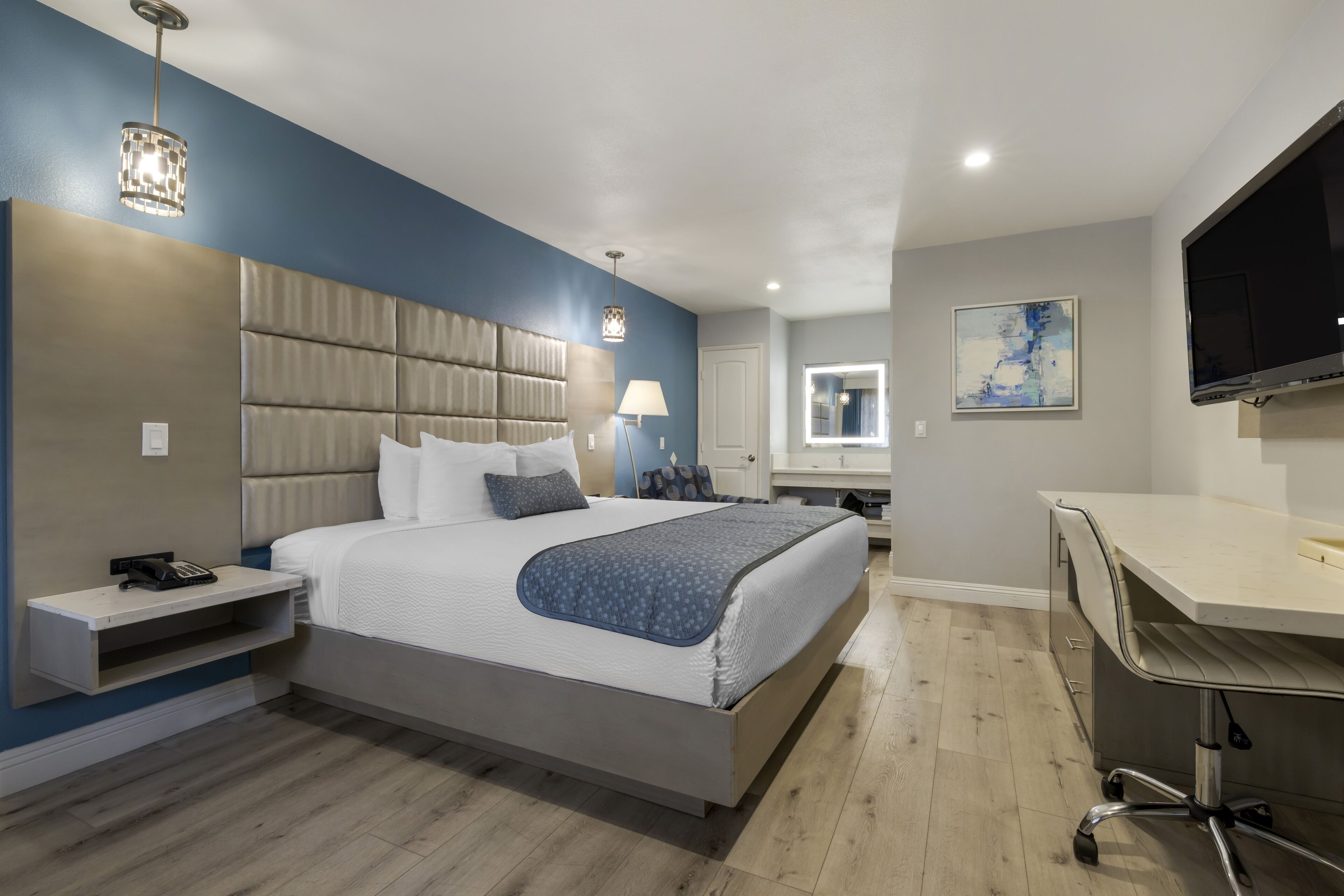 pillow-top beds, desk, laptop workspace, blackout curtains