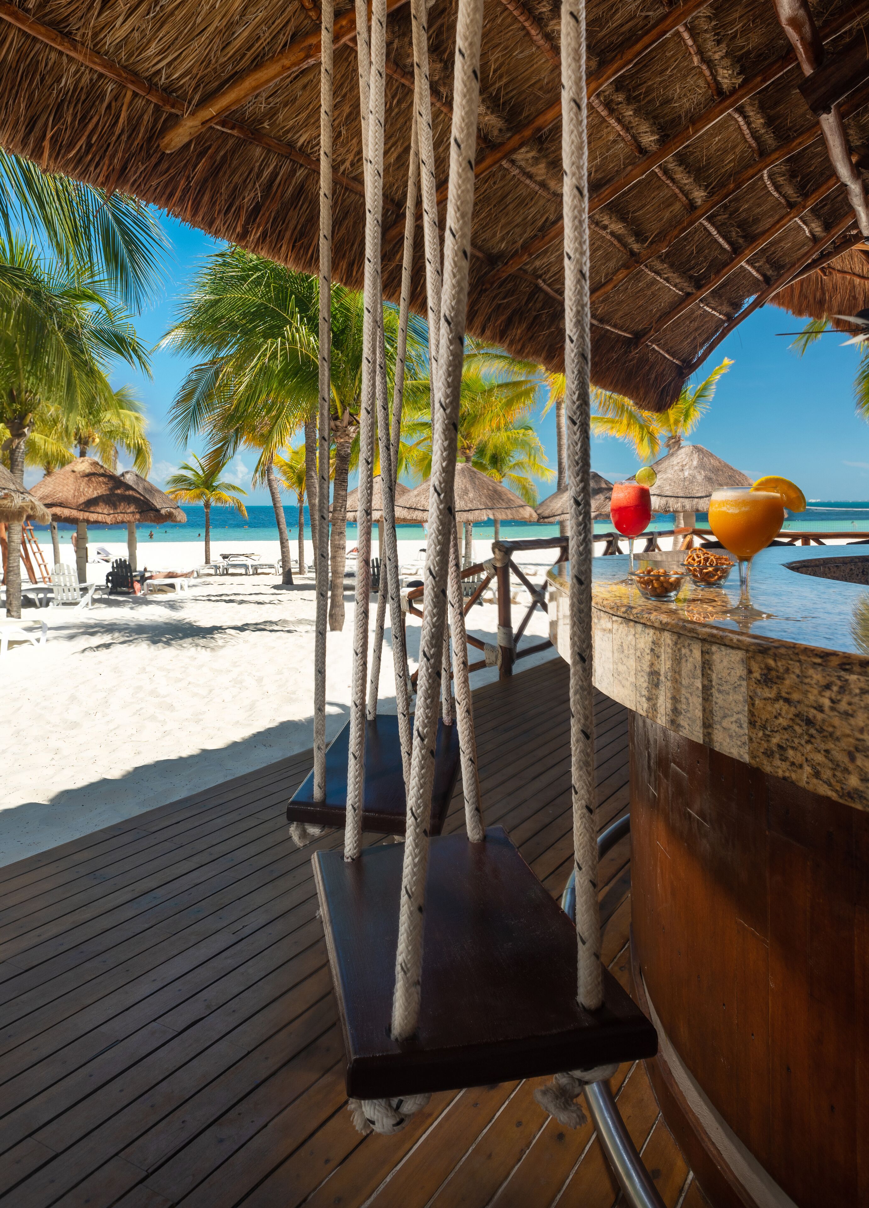 On the beach, white sand, beach umbrellas, beach towels