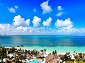 On the beach, white sand, beach umbrellas, beach towels