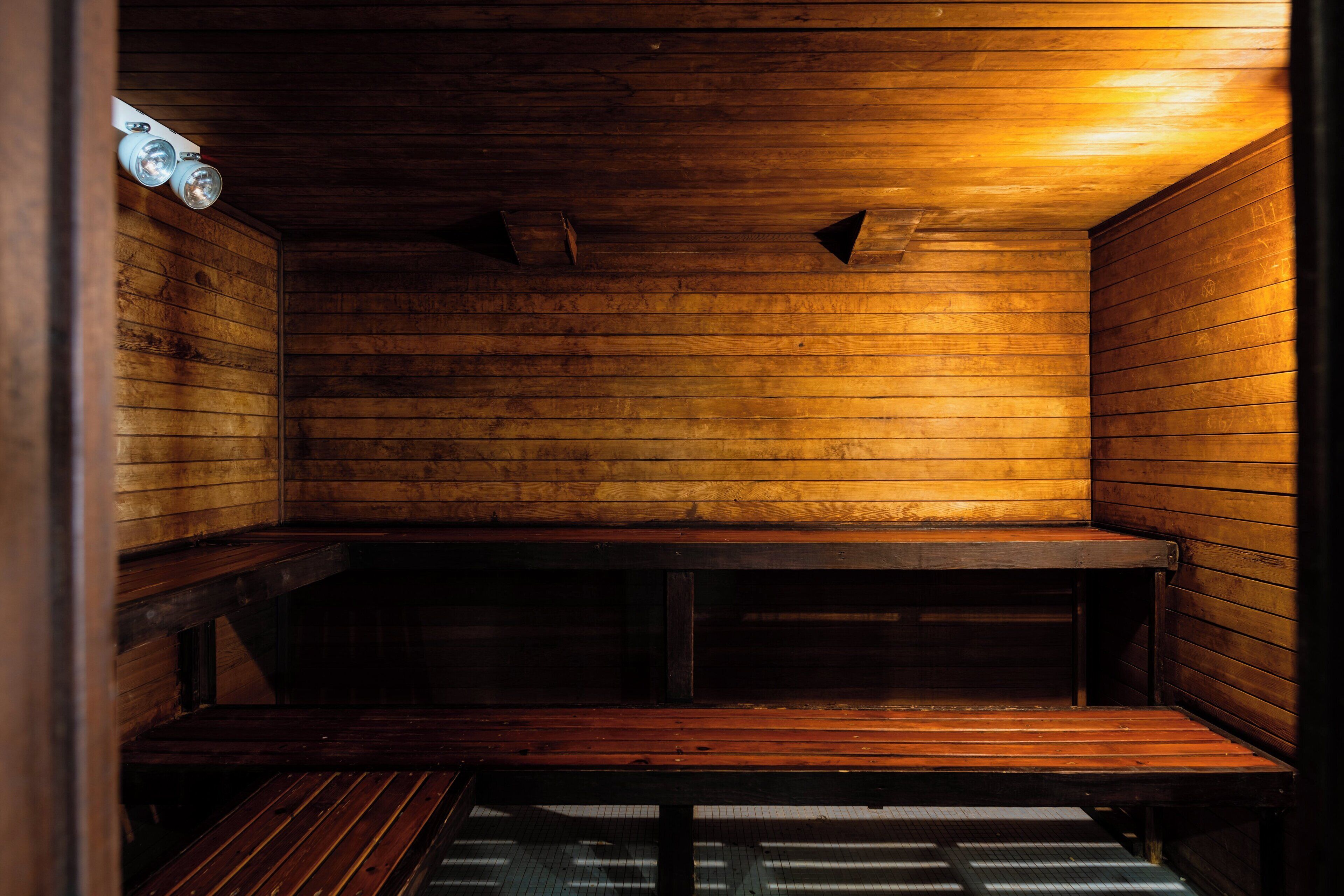 A sauna with wooden walls and benches.