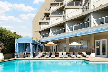 Outdoor pool amenities at Hyatt Centric Delfina Santa Monica