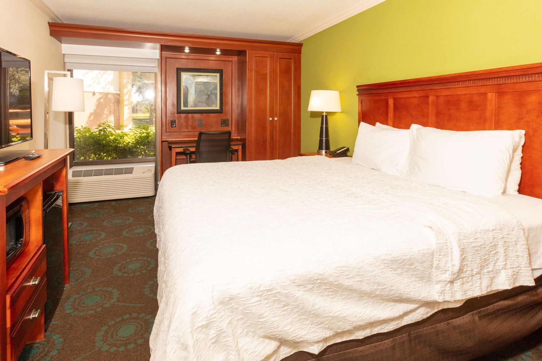 Desk, blackout drapes, iron/ironing board, free cribs/infant beds