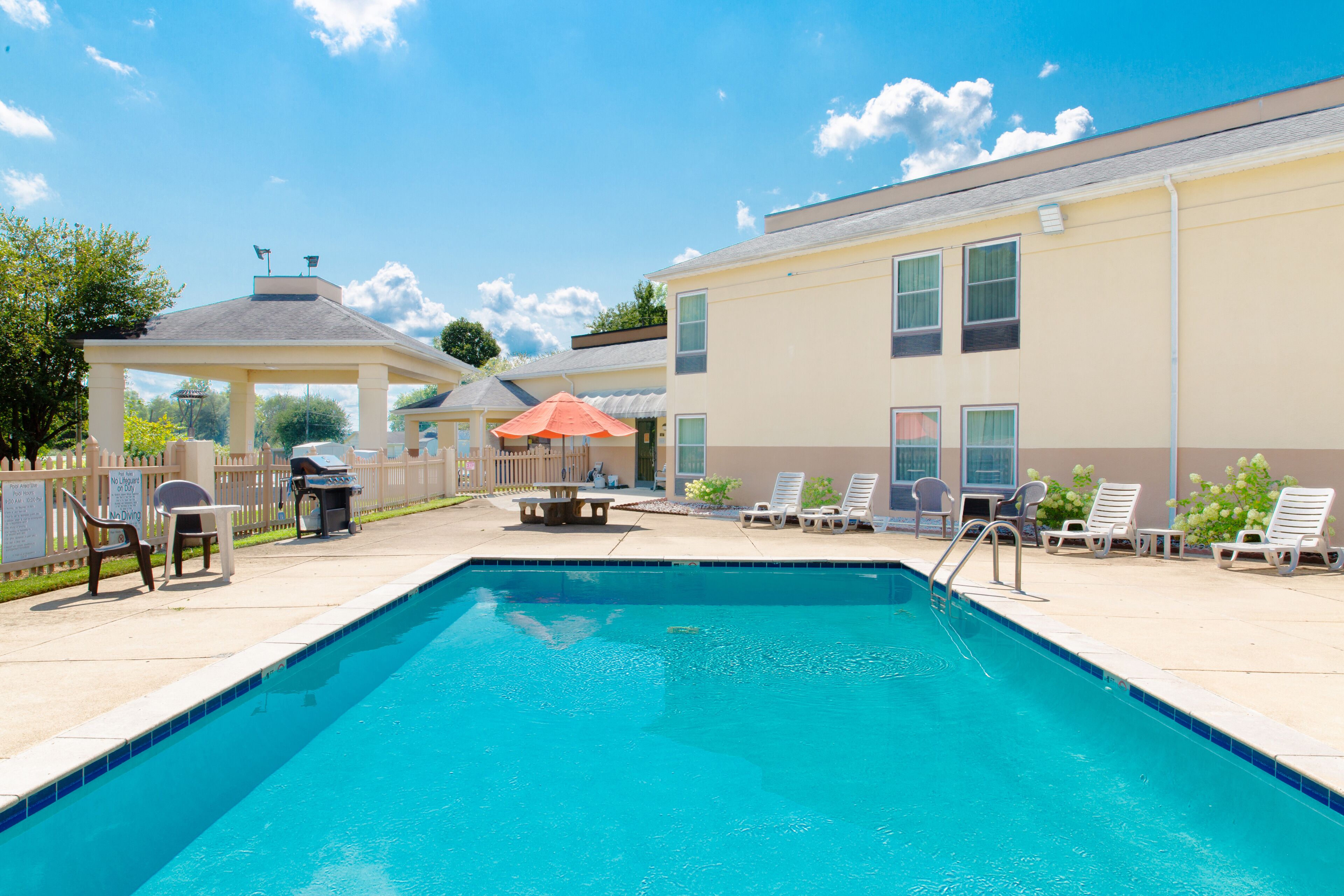 Seasonal outdoor pool, open 9:00 AM to 10:00 PM, pool umbrellas