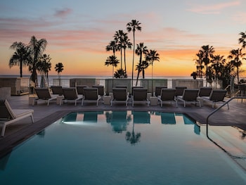 Outdoor pool, cabanas (surcharge), pool umbrellas at Regent Santa Monica Beach