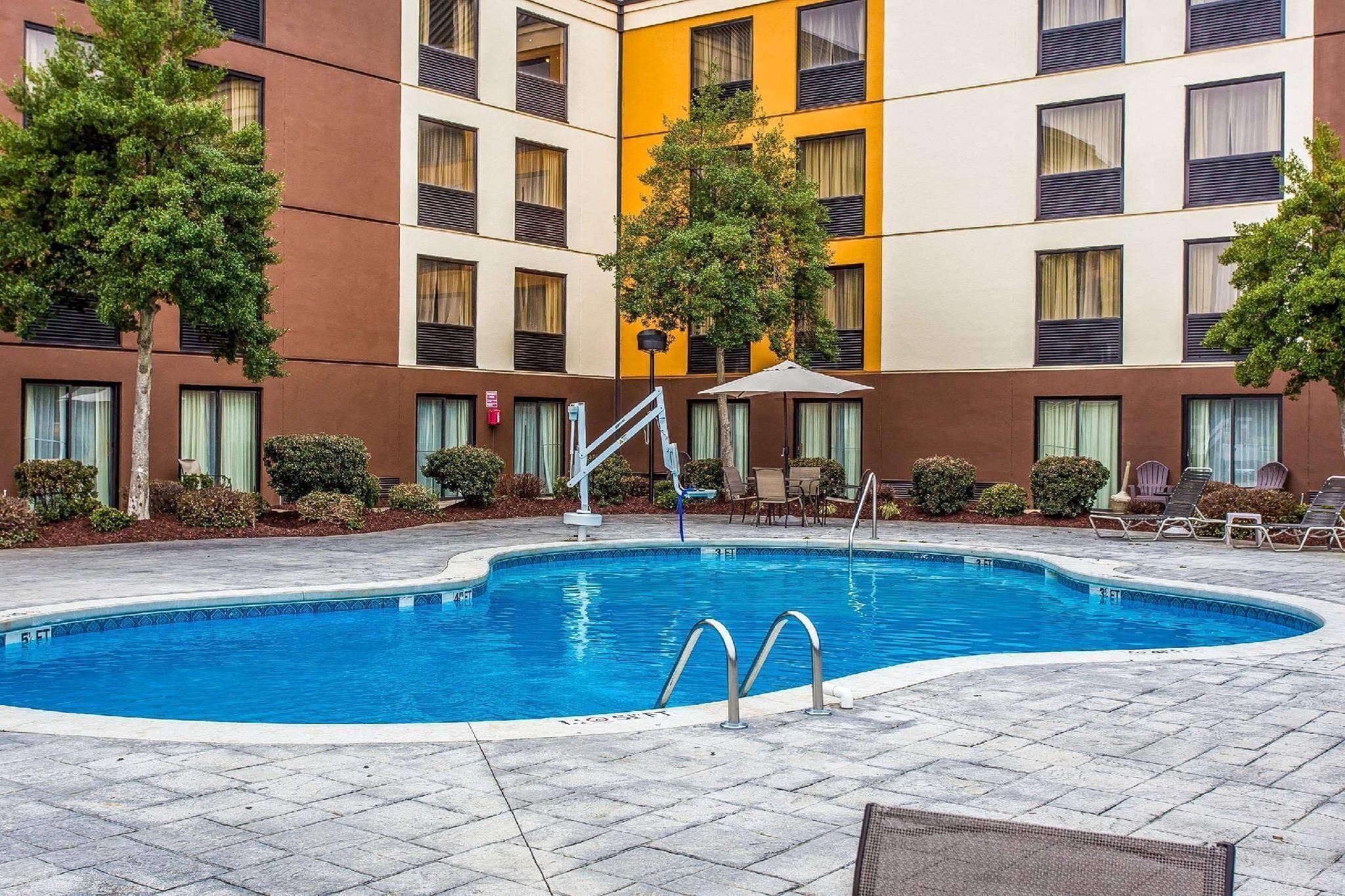 Seasonal outdoor pool, open 10 AM to 10:00 PM, pool umbrellas