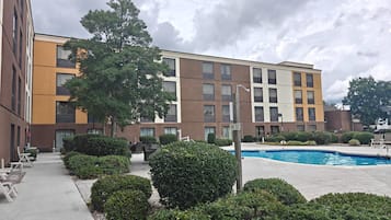 Seasonal outdoor pool, open 10 AM to 10:00 PM, pool umbrellas