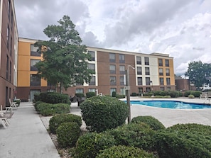 Seasonal outdoor pool, open 10 AM to 10:00 PM, pool umbrellas