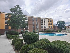 Seasonal outdoor pool, open 10 AM to 10:00 PM, pool umbrellas - Comfort Inn Fort Mill Amusement Park at Carowinds Blvd (Fort Mill)