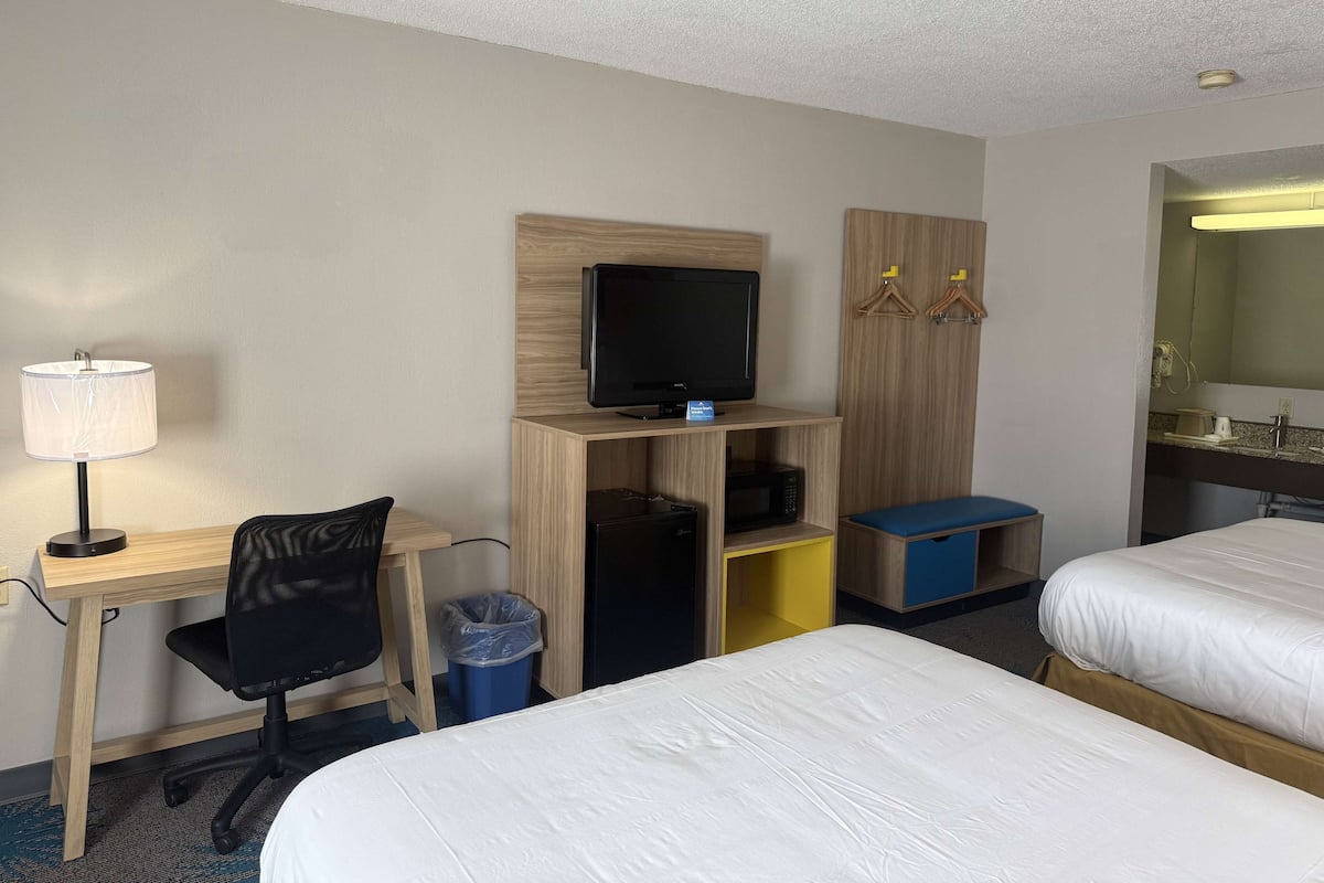 Desk, laptop workspace, free WiFi, bed sheets