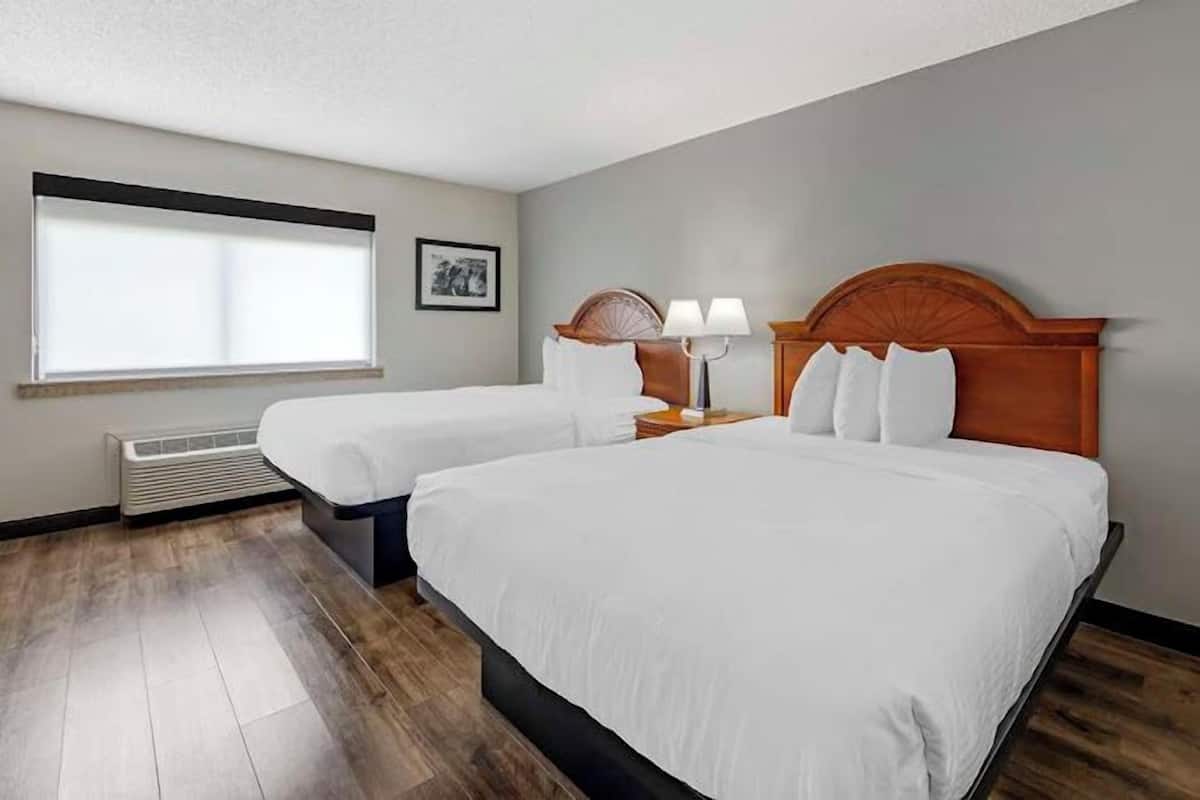 Pillow-top beds, desk, laptop workspace, blackout curtains