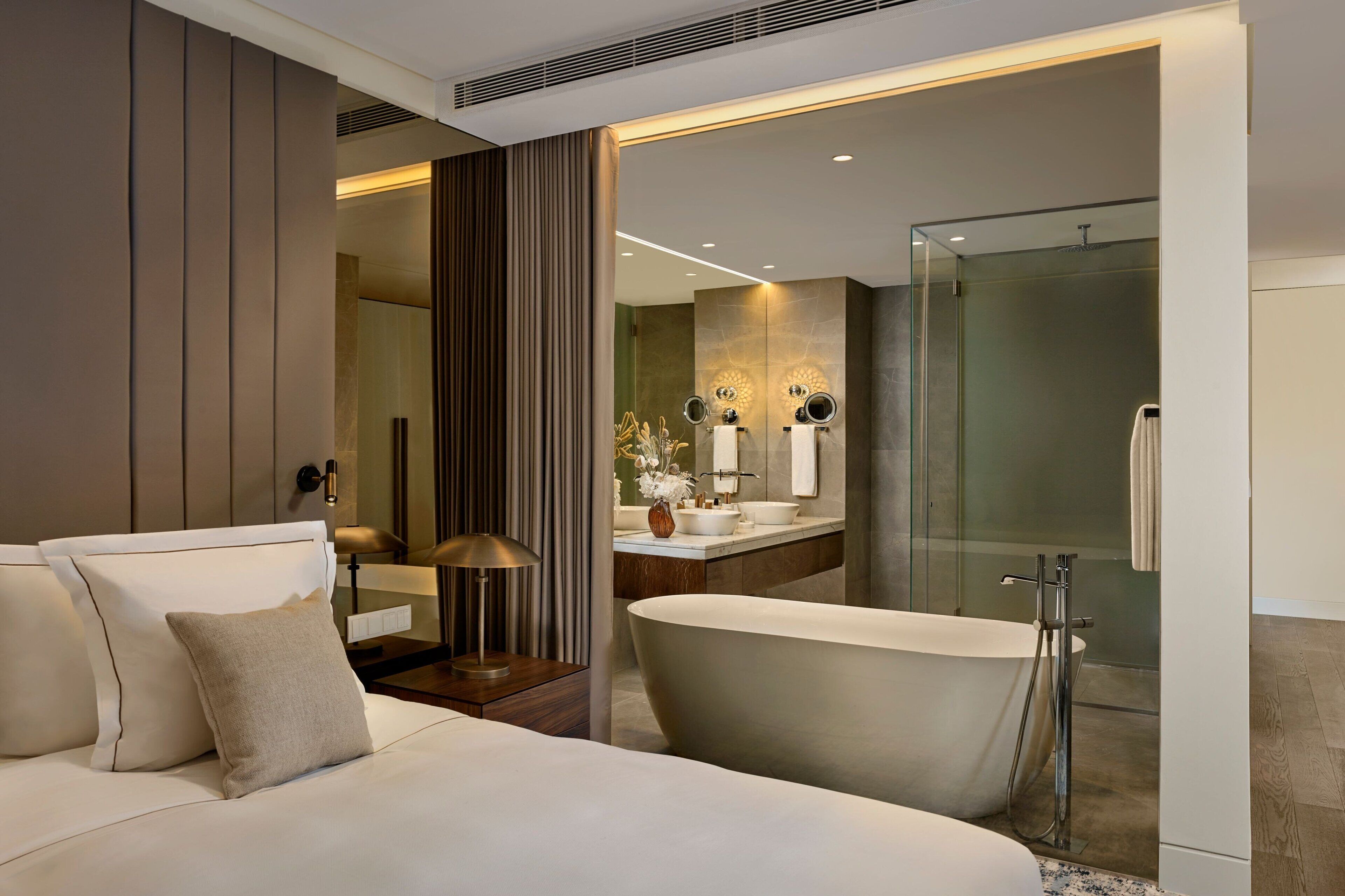 Separate tub and shower, designer toiletries, hair dryer, bathrobes