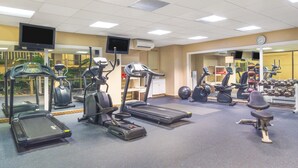 A gym with treadmills, elliptical machines, and free weights. - Days Inn by Wyndham Columbus Airport (Columbus)