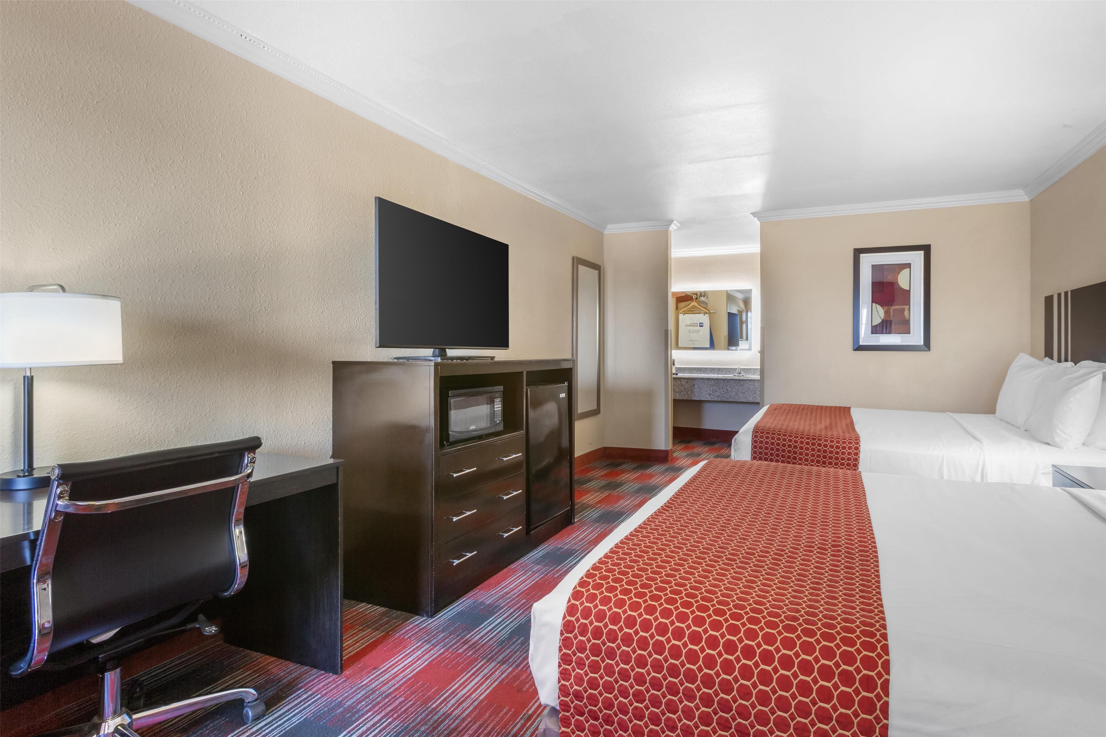 standard room, 2 queen beds, non smoking, refrigerator & microwave (walk-in shower) | pillow-top beds, desk, laptop workspace, iron/ironing board