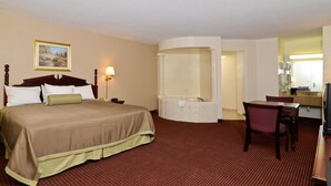 Standard Room | Living area | 32-inch flat-screen TV with cable channels, TV - Travelers Inn and Suites (Memphis)