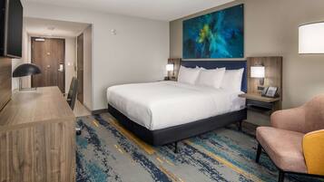 Premium bedding, desk, laptop workspace, blackout drapes