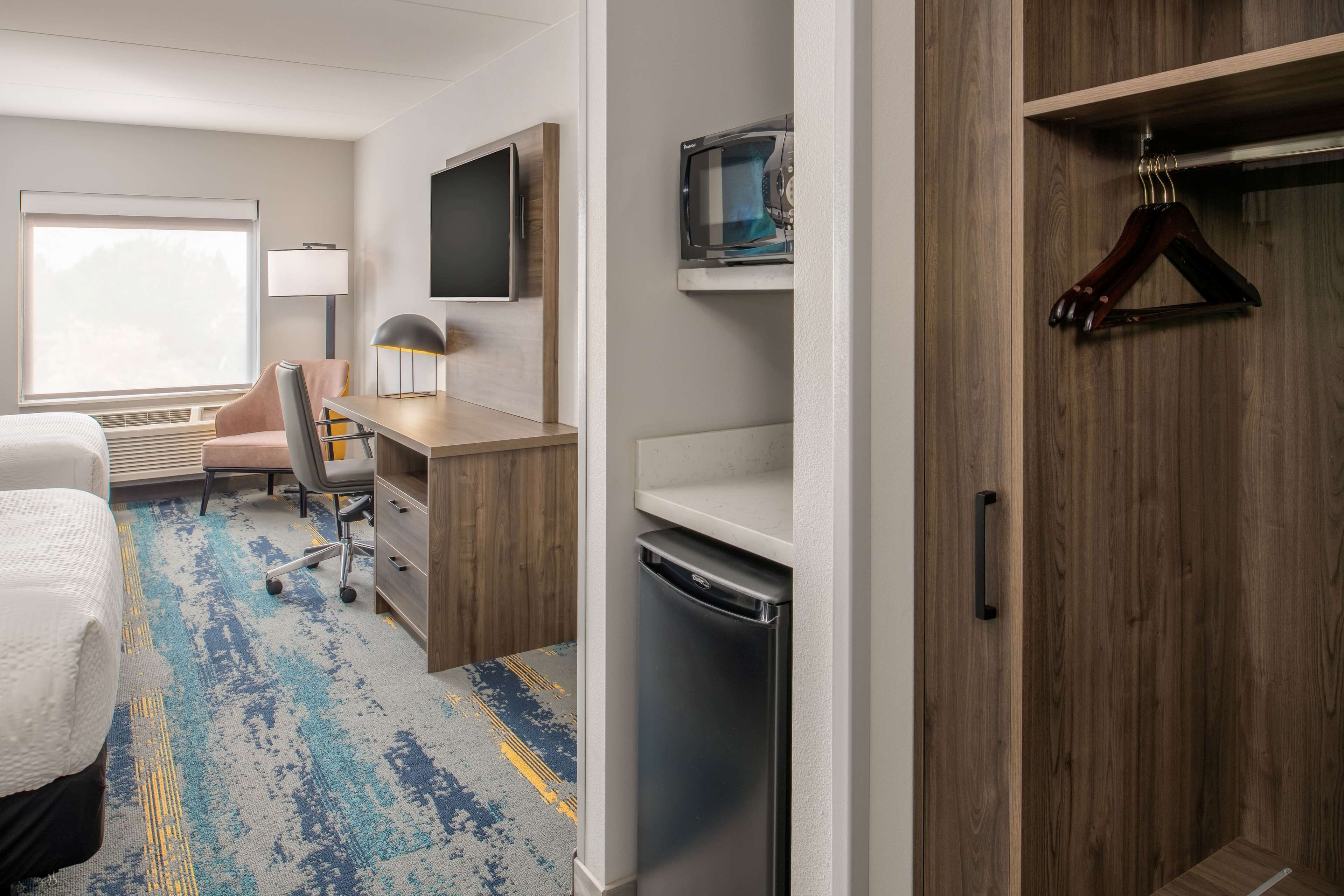 premium bedding, desk, laptop workspace, blackout curtains