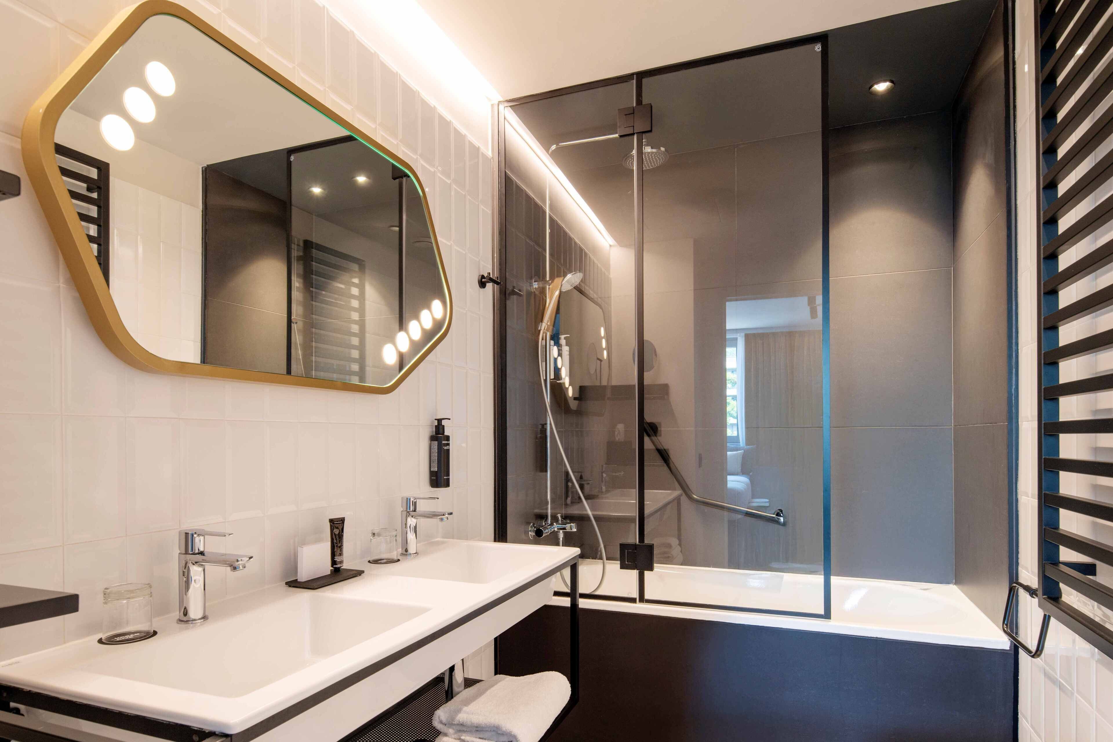 Eco-friendly toiletries, hair dryer, slippers, bidet