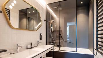 Eco-friendly toiletries, hair dryer, slippers, bidet