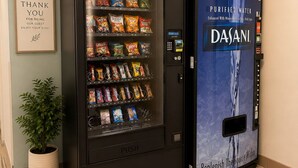A vending machine with snacks and a water dispenser. - Days Inn by Wyndham Hinckley (Hinckley)