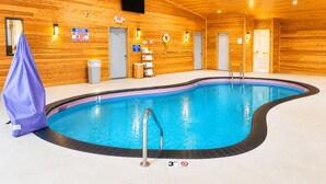 An indoor swimming pool with wooden walls, a lifeguard warning sign, and a 3-foot depth marker. - Days Inn by Wyndham Hinckley (Hinckley)