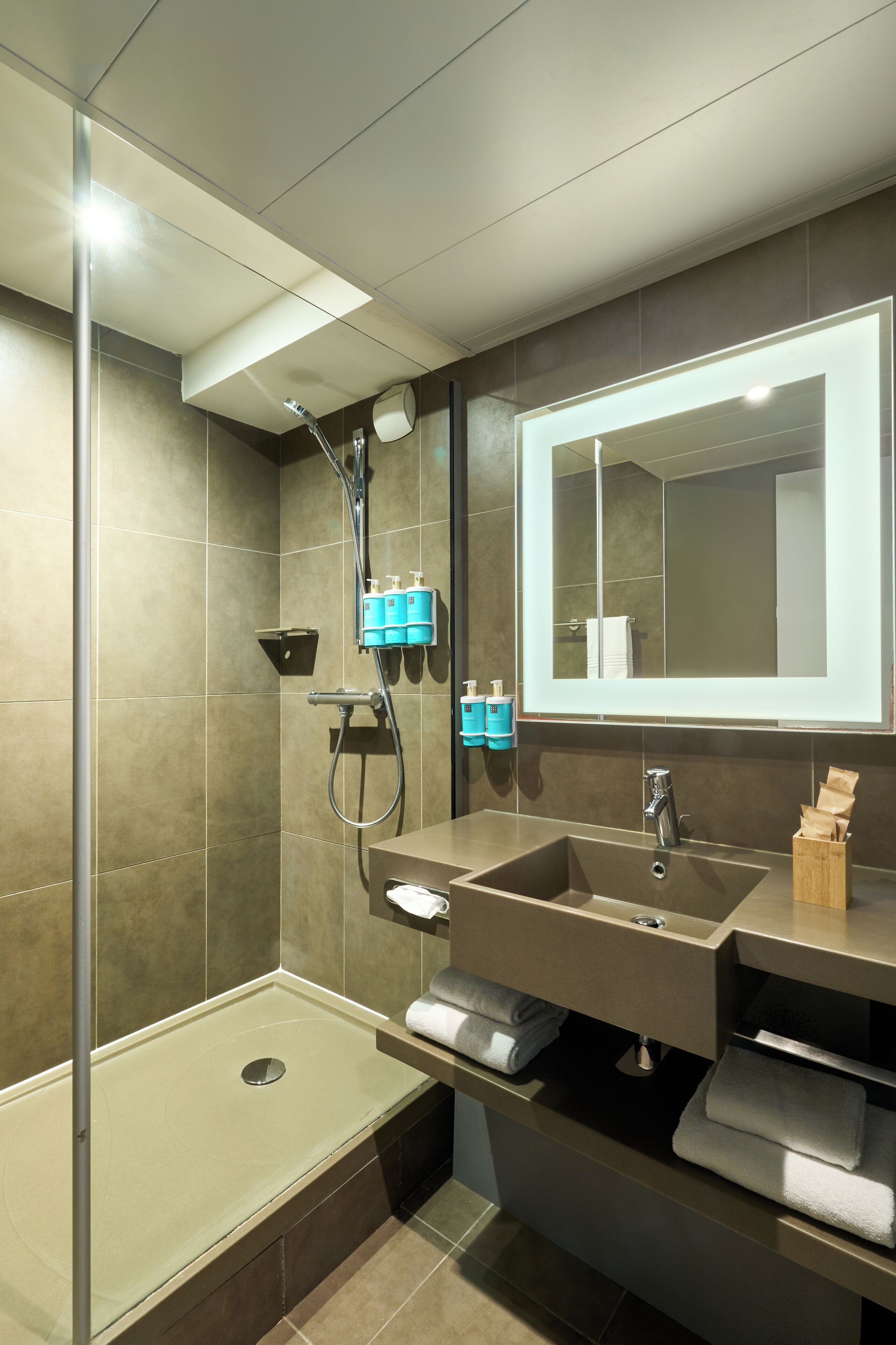 eco-friendly toiletries, hair dryer, towels