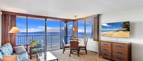 Standard Room, 1 Bedroom | Living area | 55-inch flat-screen TV with cable channels