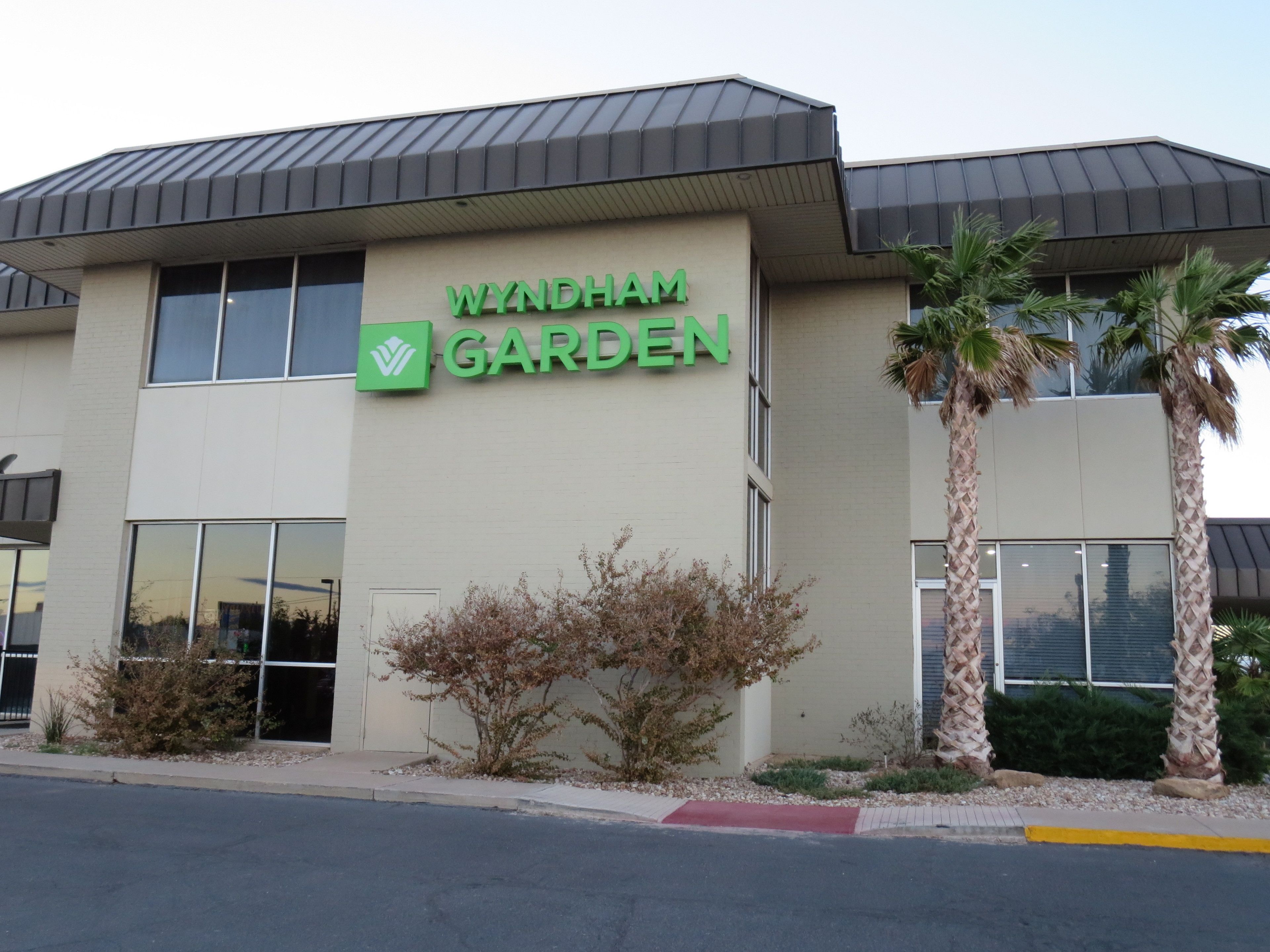 A building with a sign reading "Wyndham Garden".