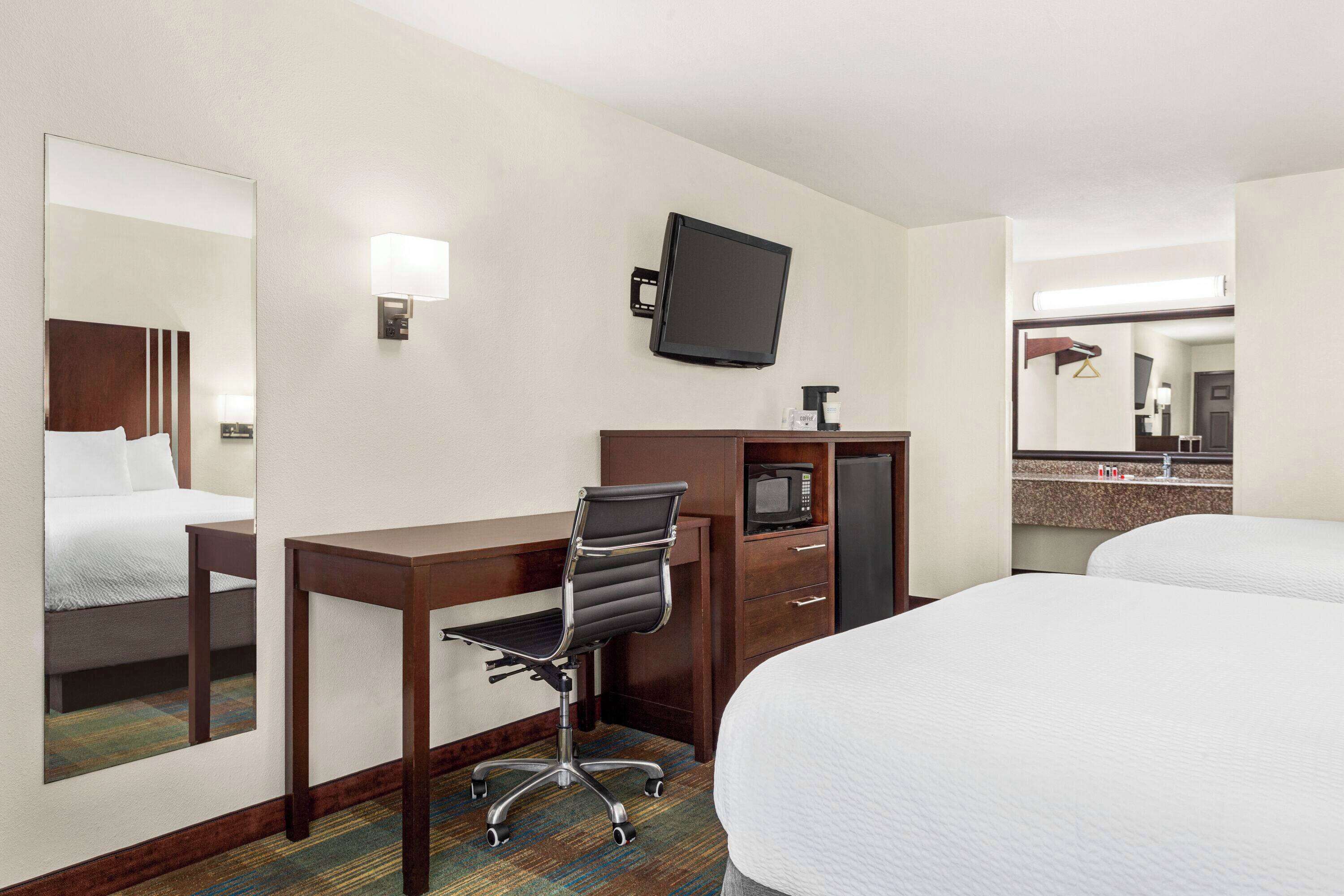 deluxe room, 2 queen beds | in-room safe, laptop workspace, blackout curtains, iron/ironing board