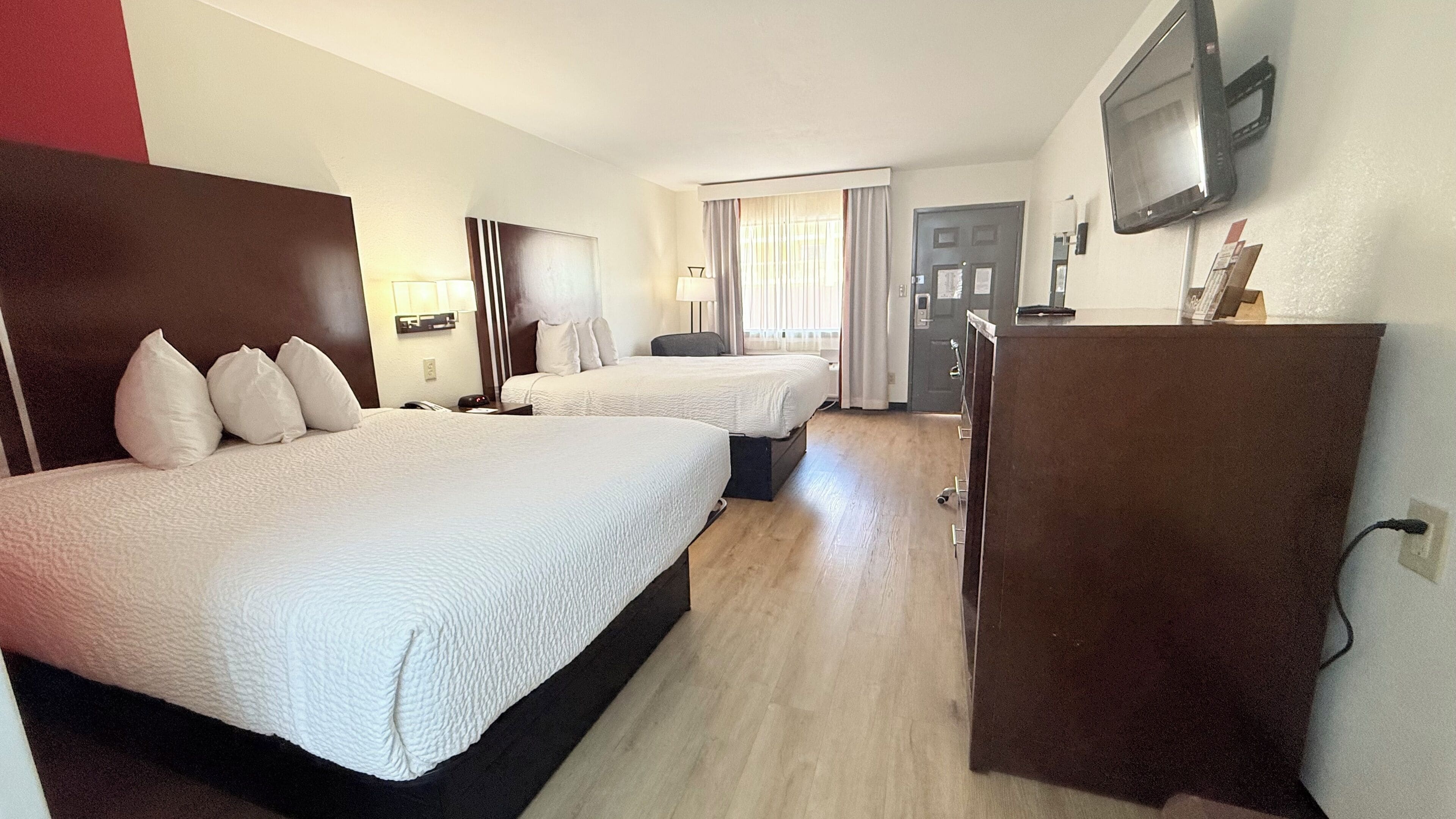 deluxe room, 2 queen beds | in-room safe, laptop workspace, blackout curtains, iron/ironing board
