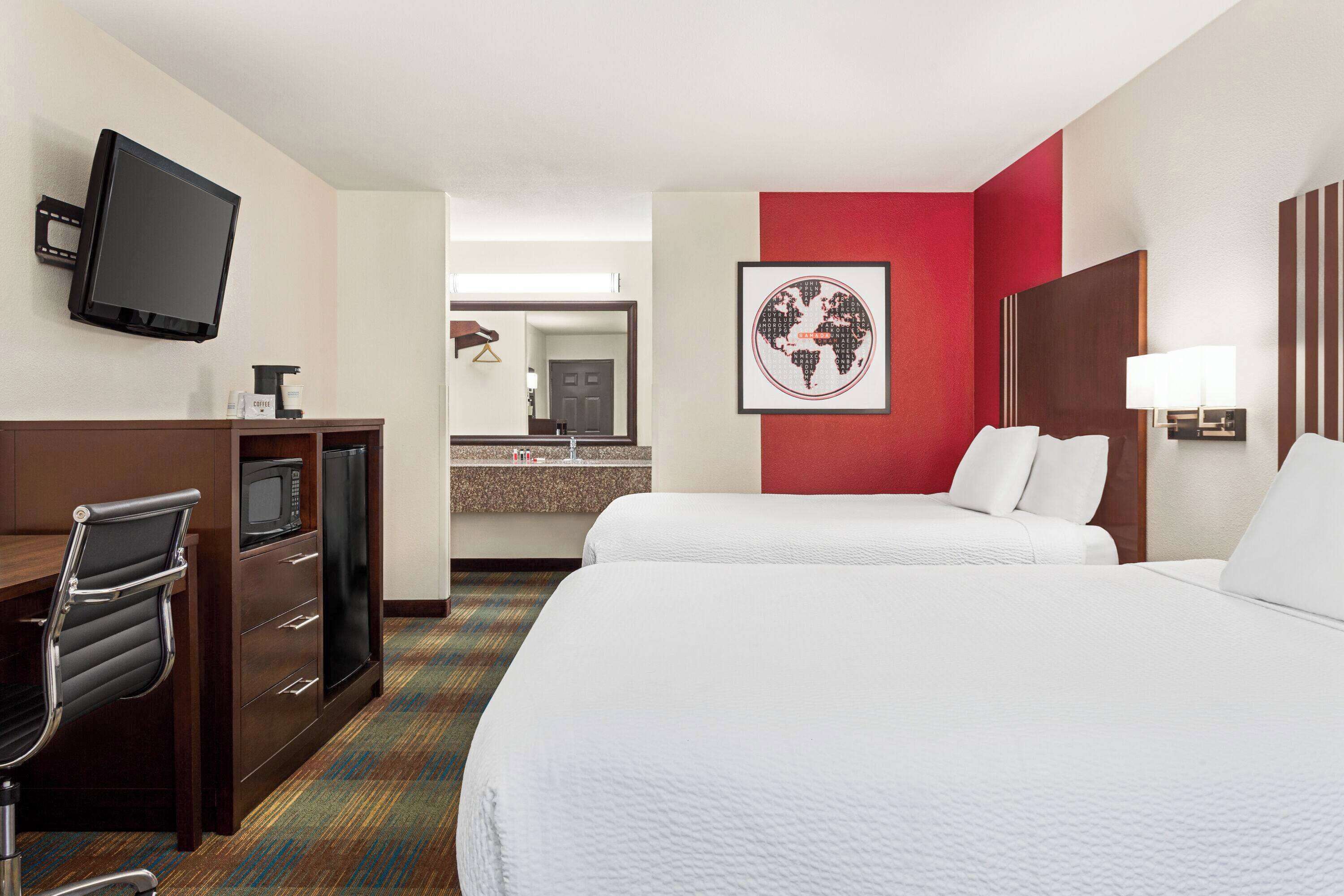 deluxe room, 2 queen beds | in-room safe, laptop workspace, blackout curtains, iron/ironing board